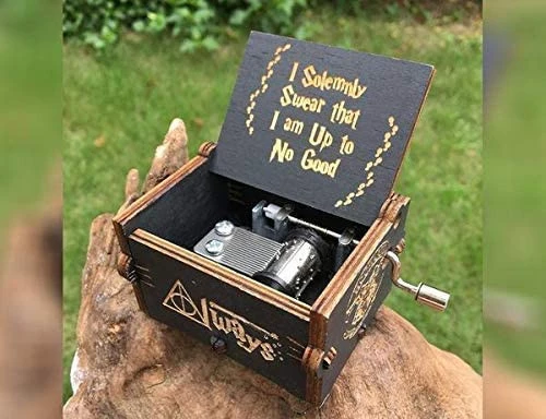 A wooden music box with a design inspired by the Harry Potter movie series, a mini box decorated with laser engraved engravings that you can customize to present as a gift from the husband to his wife